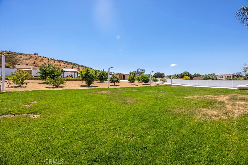 32797 Hayden Road Menifee, CA 92584 - Photo 38 of 51 a view of a building and trees in the background