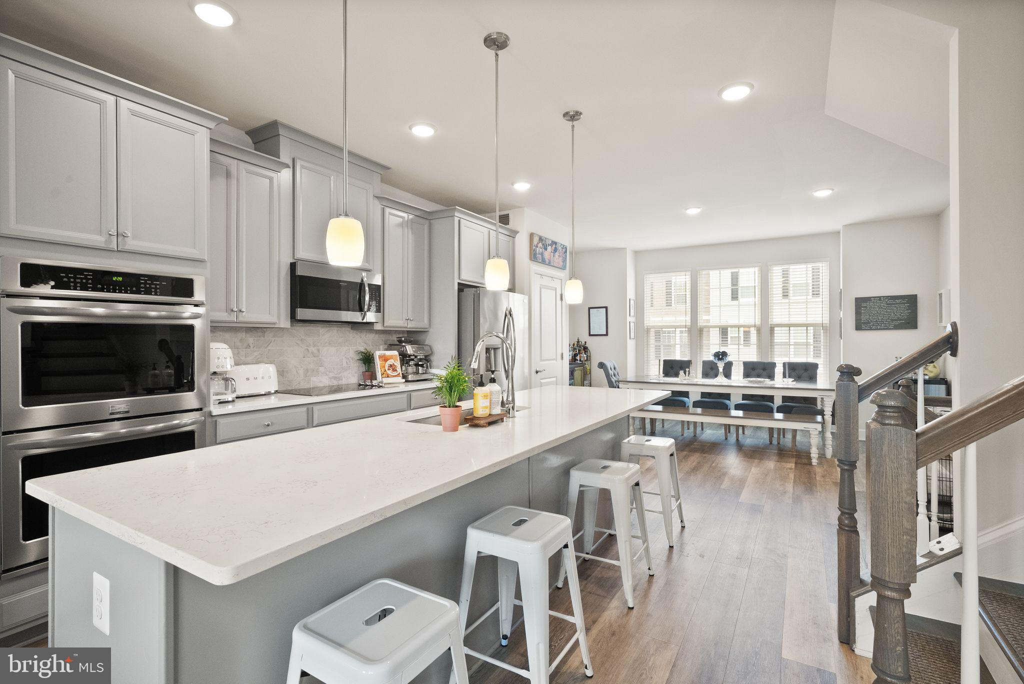 13803 Litespeed Way Gainesville, VA 20155 - Photo 12 of 37 a kitchen with a sink appliances and cabinets