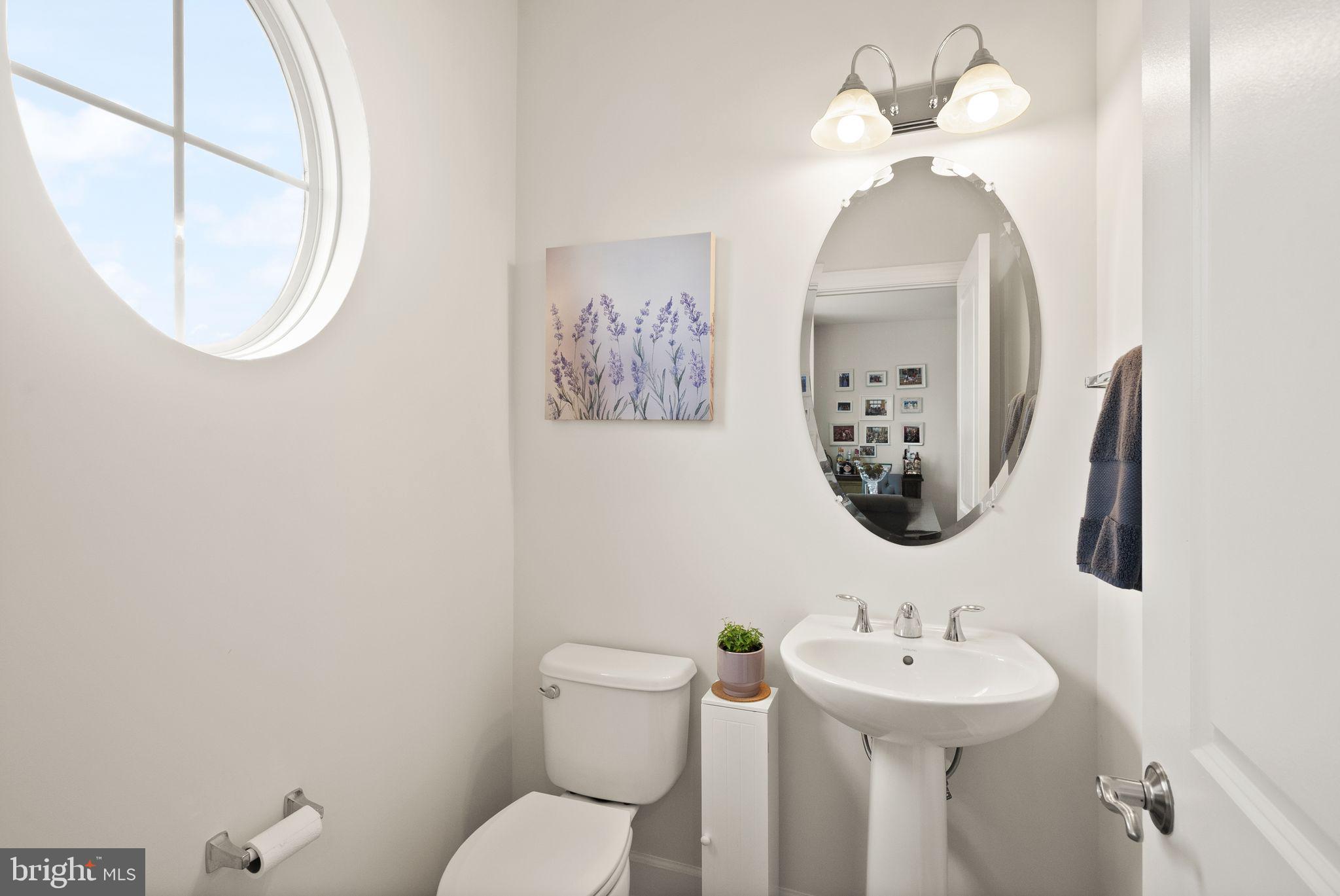 13803 Litespeed Way Gainesville, VA 20155 - Photo 16 of 37 a bathroom with a toilet sink and mirror