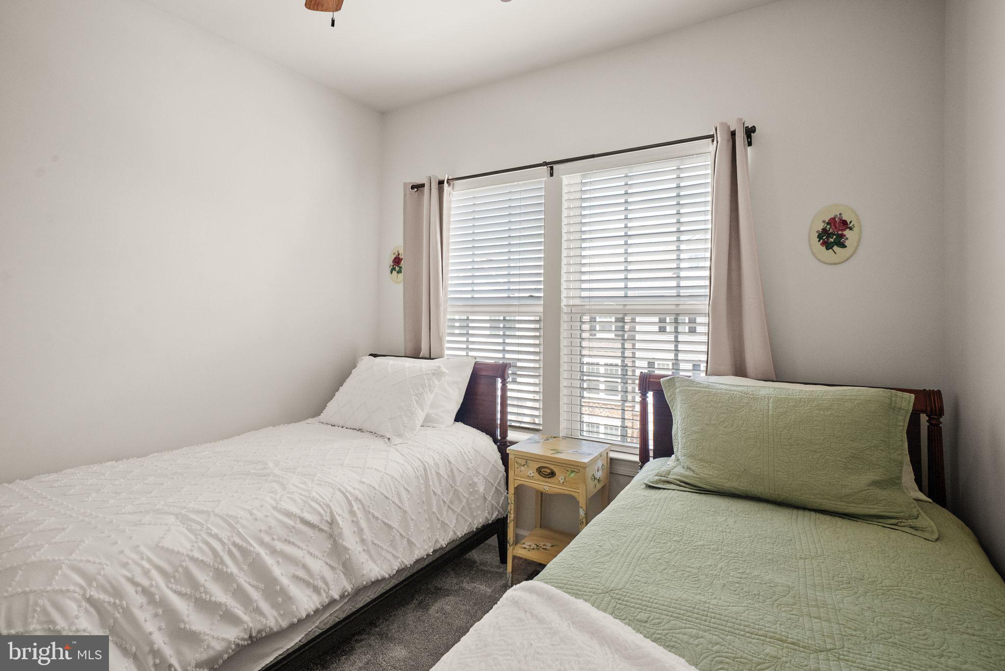 13803 Litespeed Way Gainesville, VA 20155 - Photo 26 of 37 a large bed sitting in a bedroom next to a window
