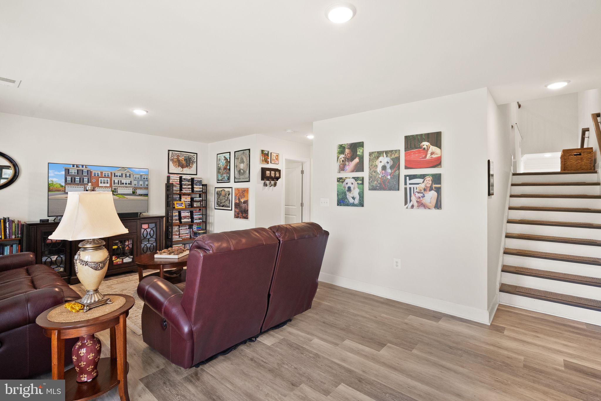 13803 Litespeed Way Gainesville, VA 20155 - Photo 30 of 37 a living room with furniture and a wooden floor