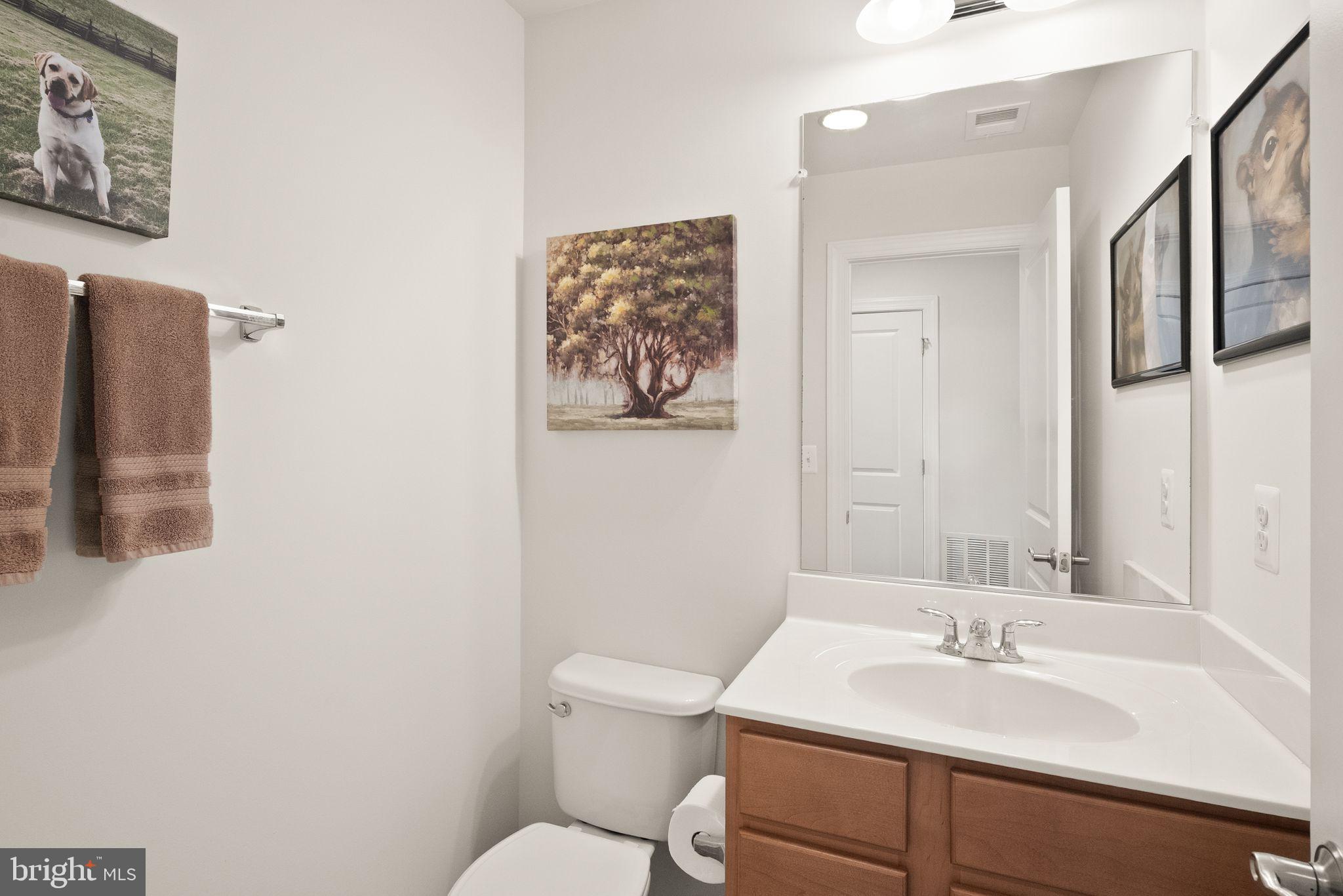 13803 Litespeed Way Gainesville, VA 20155 - Photo 32 of 37 a bathroom with a toilet sink and mirror