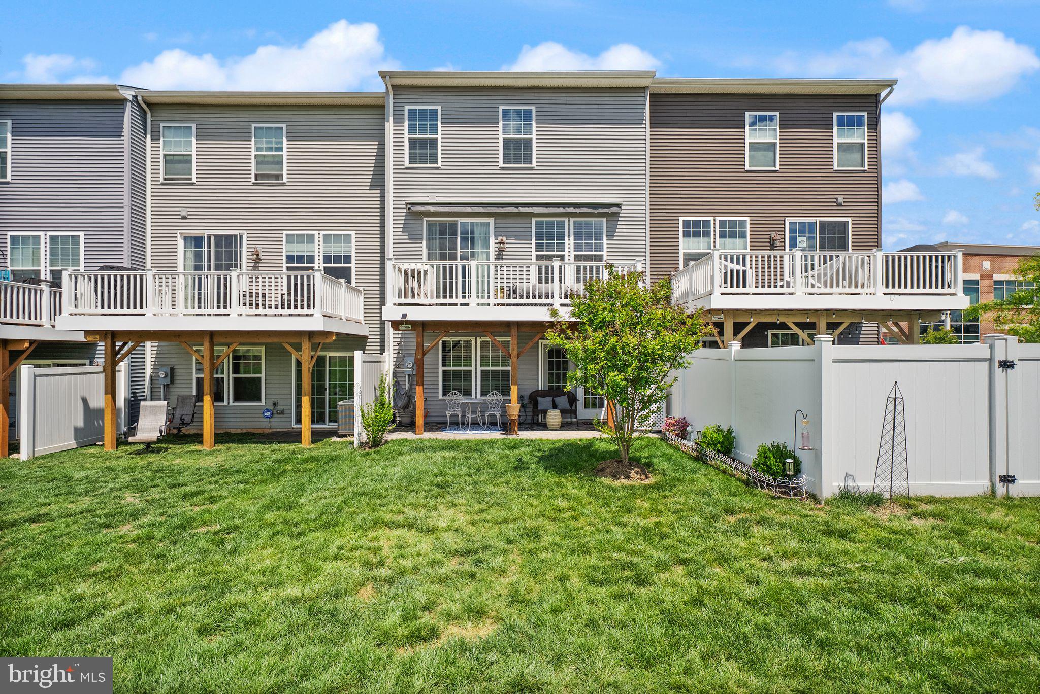 13803 Litespeed Way Gainesville, VA 20155 - Photo 34 of 37 a view of a building with a yard