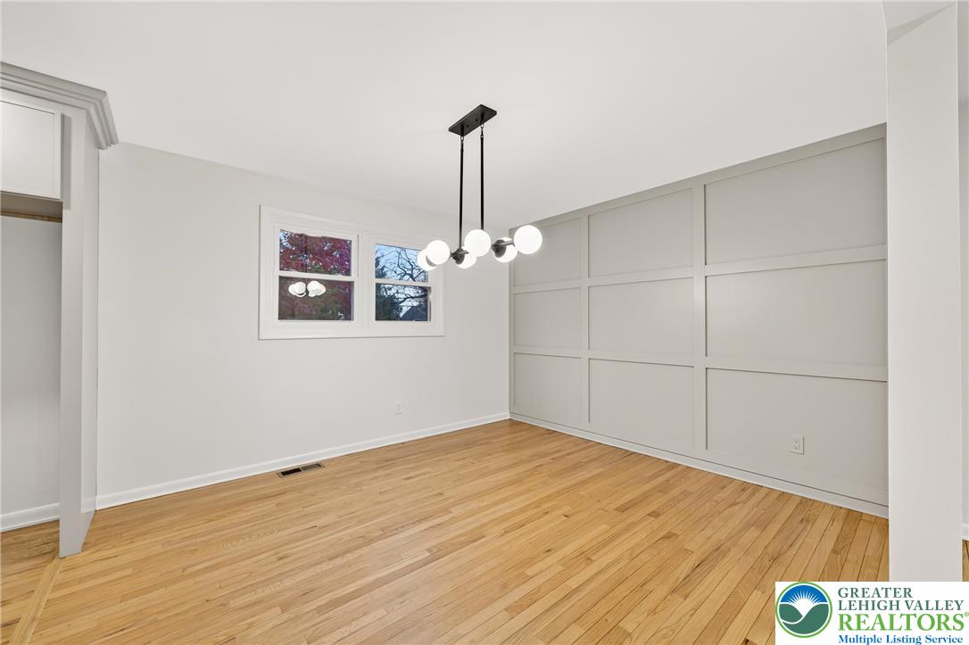 1285 Stafore Drive Bethlehem, PA 18017 - Photo 16 of 56 a view of a room with wooden floor ceiling fan and window