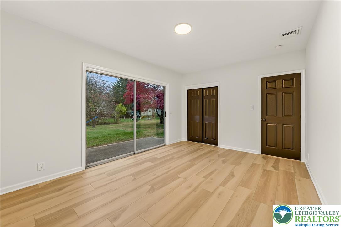 1285 Stafore Drive Bethlehem, PA 18017 - Photo 21 of 56 a view of empty room with wooden floor and fan