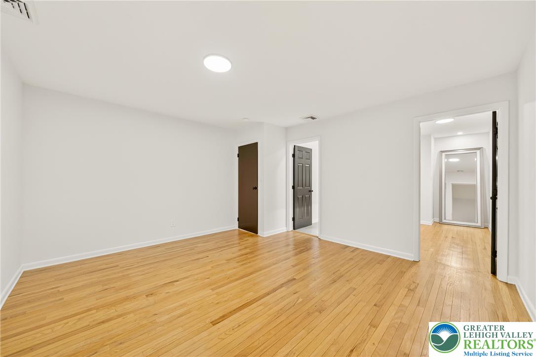 1285 Stafore Drive Bethlehem, PA 18017 - Photo 26 of 56 a view of an empty room with wooden floor
