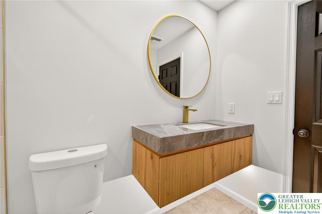 1285 Stafore Drive Bethlehem, PA 18017 - Photo 28 of 56 a bathroom with a sink and a mirror