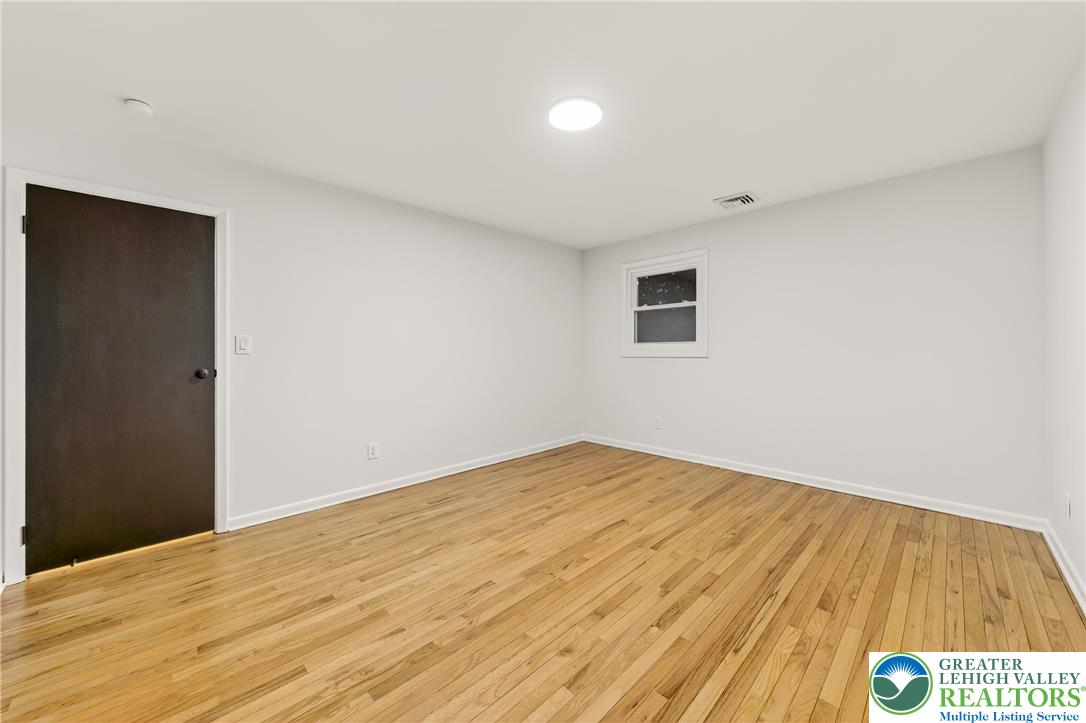 1285 Stafore Drive Bethlehem, PA 18017 - Photo 33 of 56 a view of empty room with wooden floor
