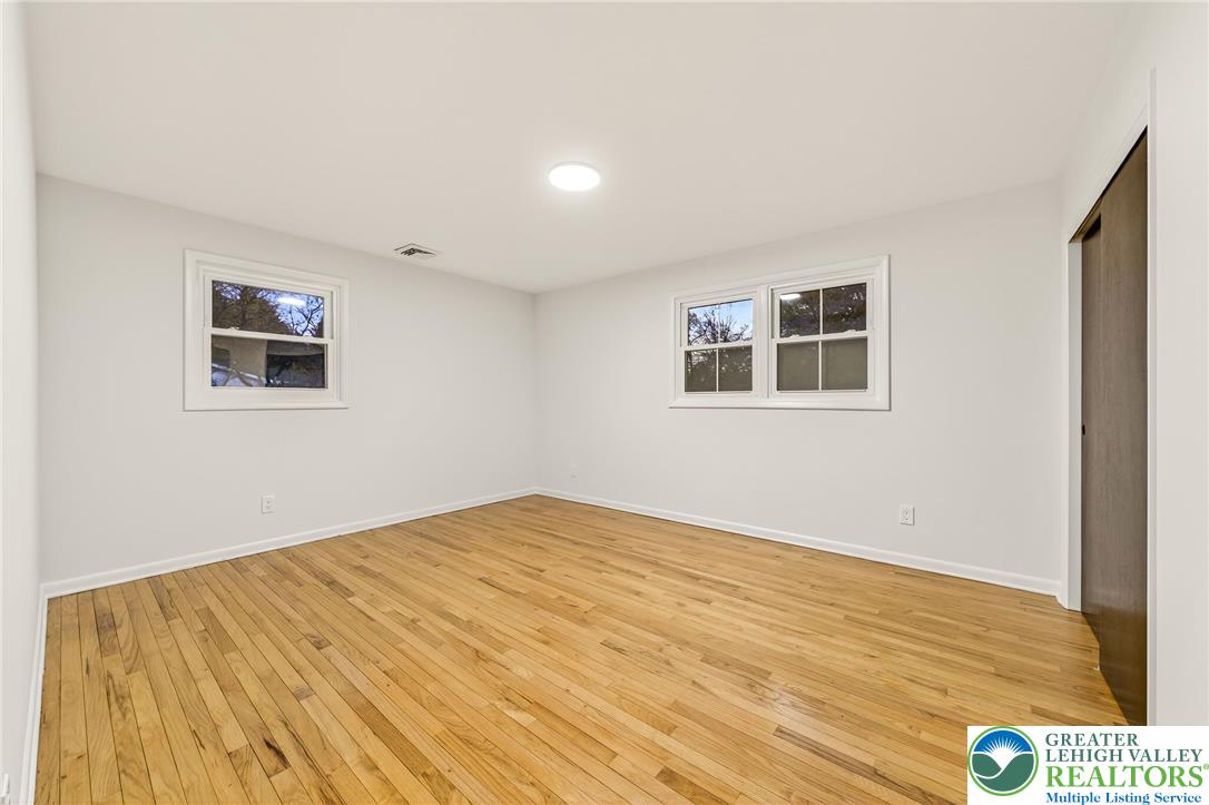 1285 Stafore Drive Bethlehem, PA 18017 - Photo 34 of 56 a view of an empty room with wooden floor and a window