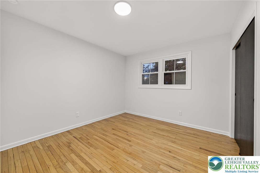 1285 Stafore Drive Bethlehem, PA 18017 - Photo 35 of 56 a view of empty room with wooden floor and fan