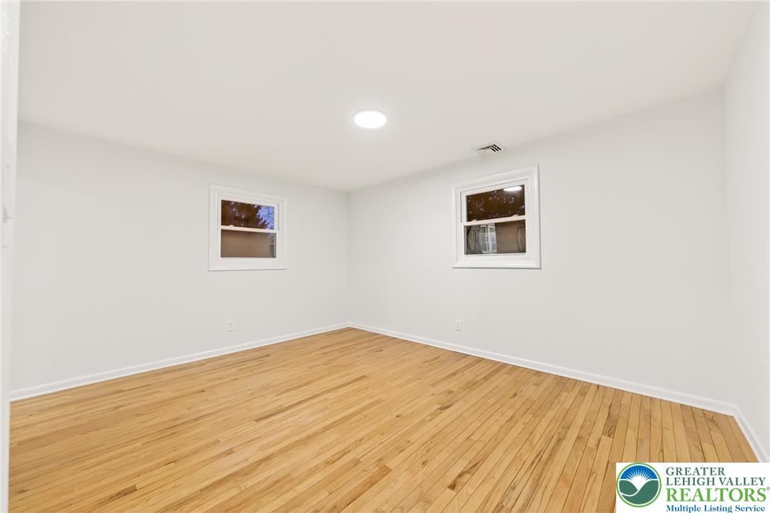 1285 Stafore Drive Bethlehem, PA 18017 - Photo 38 of 56 a view of a room with wooden floor and white walls
