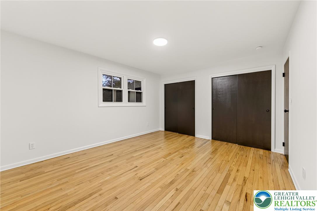 1285 Stafore Drive Bethlehem, PA 18017 - Photo 39 of 56 a view of an empty room with wooden floor