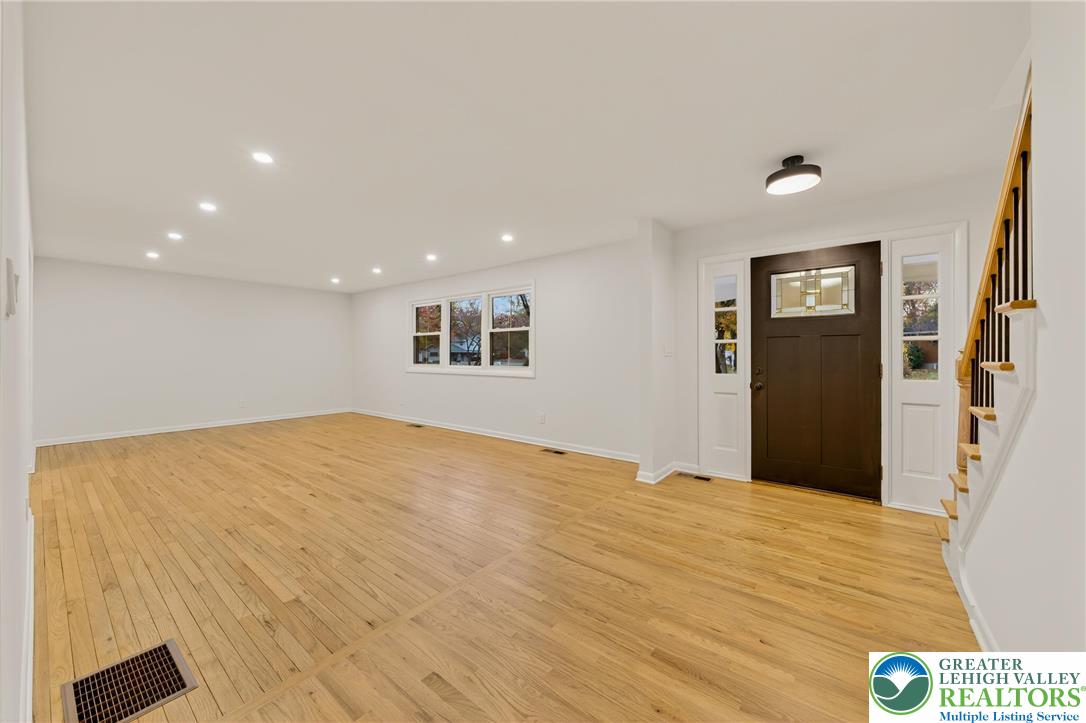 1285 Stafore Drive Bethlehem, PA 18017 - Photo 5 of 56 a bedroom with a bed and a painting on the wall