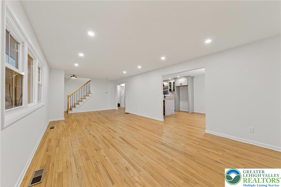 1285 Stafore Drive Bethlehem, PA 18017 - Photo 8 of 56 a view of an empty room with wooden floor and a window