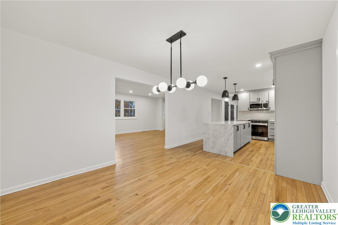 1285 Stafore Drive Bethlehem, PA 18017 - Photo 9 of 56 a view of a kitchen with wooden floor and a kitchen