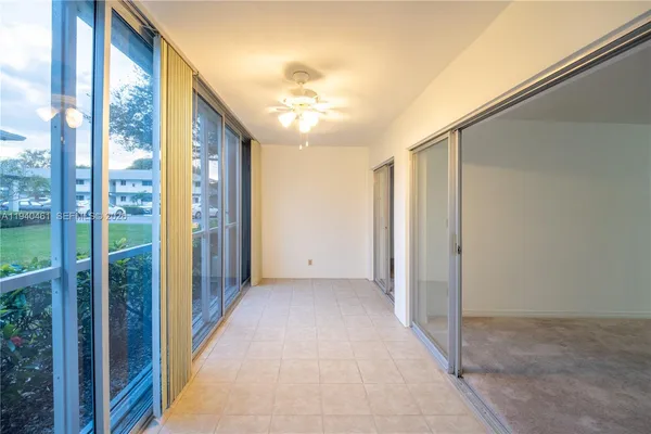 a view of a big room with windows