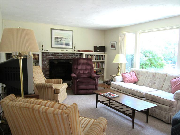 7 Ruth Lane Harwich, MA 02645 - Photo 8 of 14 a living room with furniture and a large window