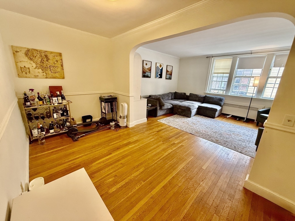 116 Park Street, Unit 2 Brookline, MA 02446 - Photo 4 of 10 a living room with furniture and a flat screen tv