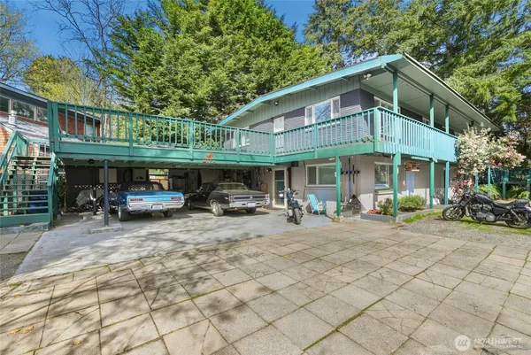a front view of a house with patio and fire pit