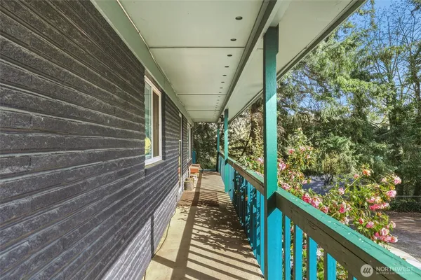 a view of balcony with wooden floor