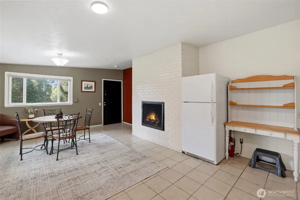 a view of a livingroom with furniture and a window