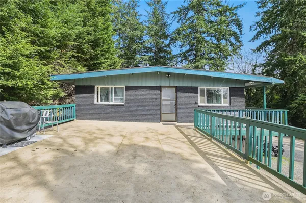 a house with trees in the background