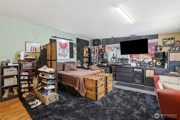 a living room with furniture and a flat screen tv