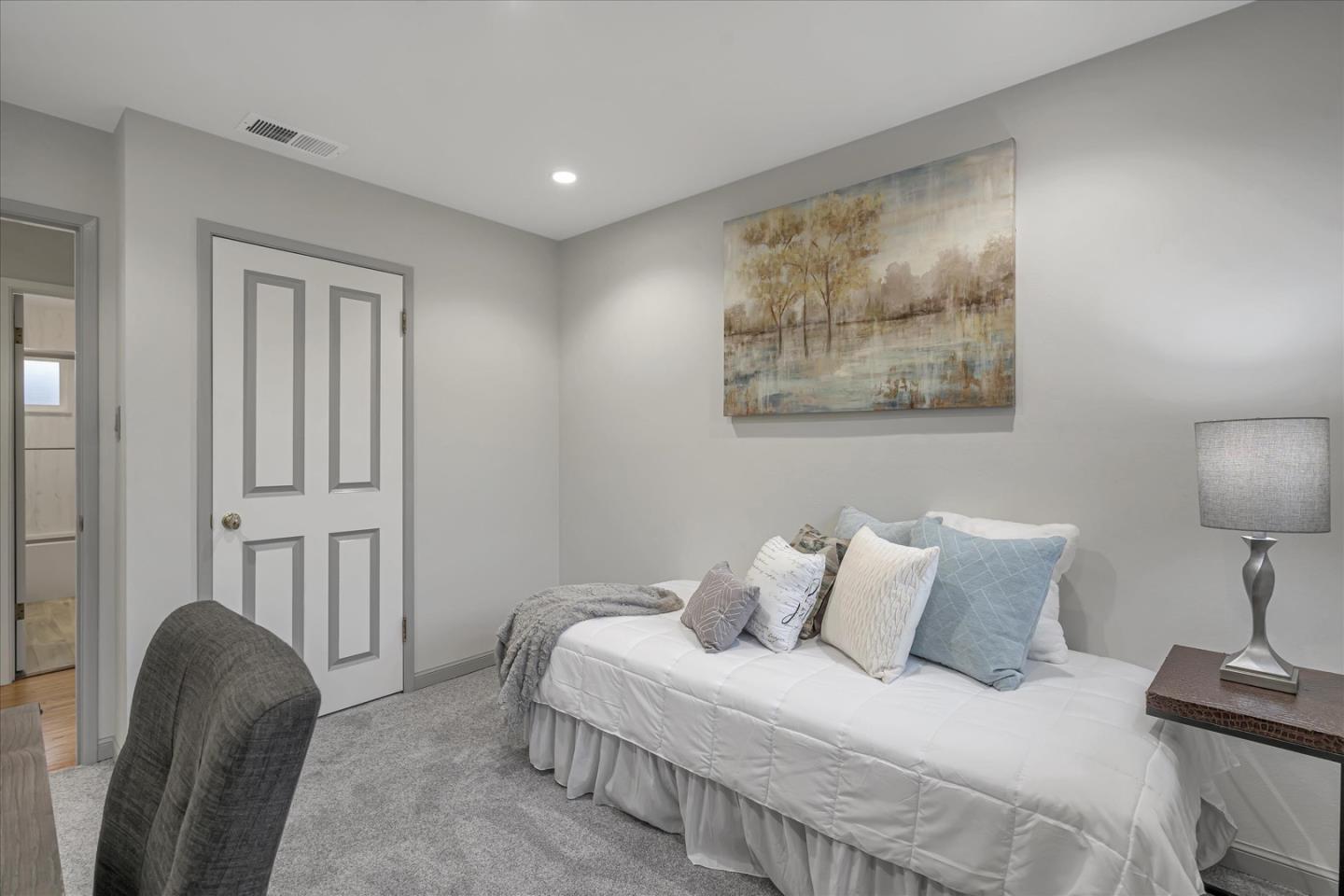 1867 Queens Road Concord, CA 94519 - Photo 17 of 30 a bedroom with a bed and a painting on the wall