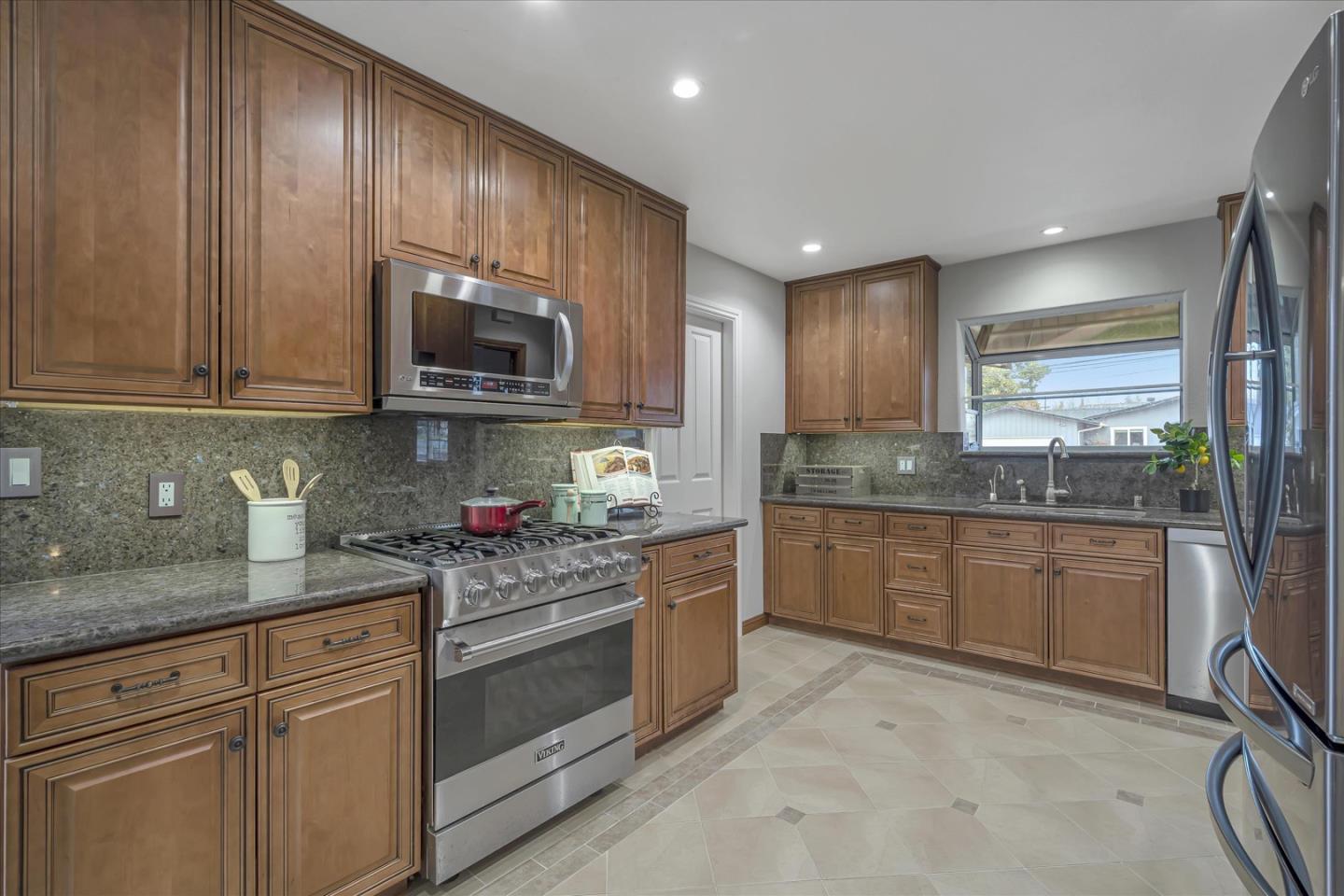1867 Queens Road Concord, CA 94519 - Photo 8 of 30 a kitchen with granite countertop cabinets stainless steel appliances and a counter space