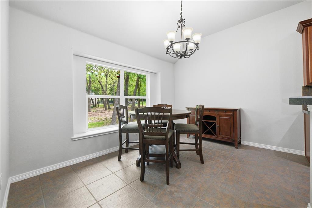 5992 Red Bud Road Fort Worth, TX 76135 - Photo 18 of 40 a view of a dining room with furniture window and outside view