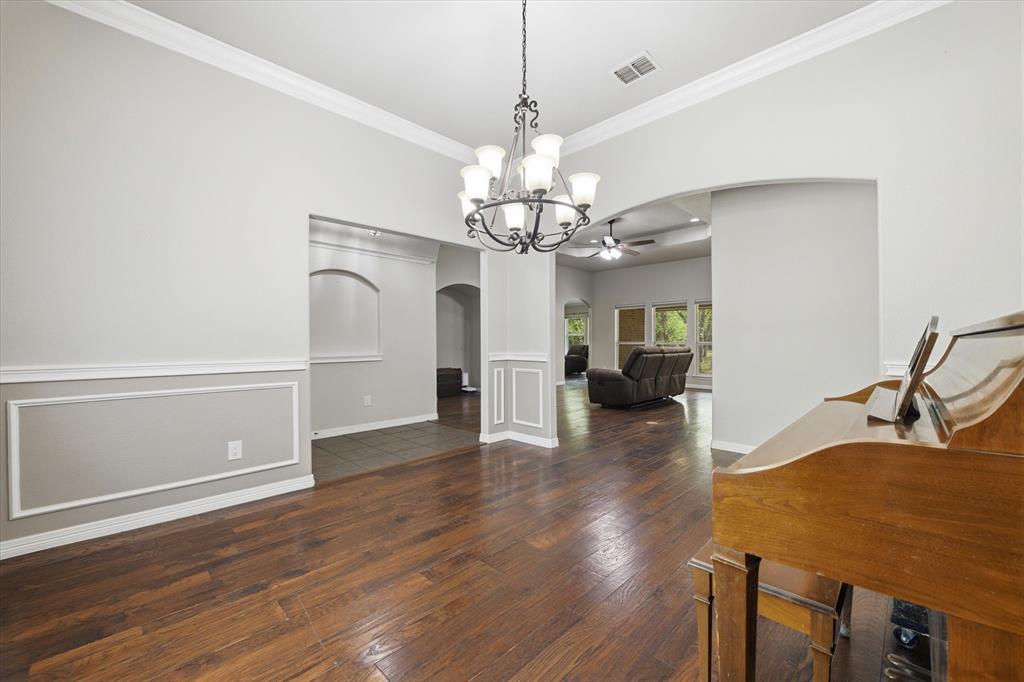 5992 Red Bud Road Fort Worth, TX 76135 - Photo 22 of 40 a view of a livingroom with wooden floor
