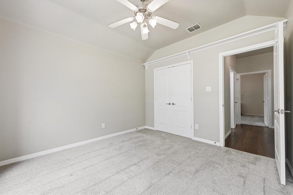 5992 Red Bud Road Fort Worth, TX 76135 - Photo 27 of 40 a view of a chandelier fan in a room