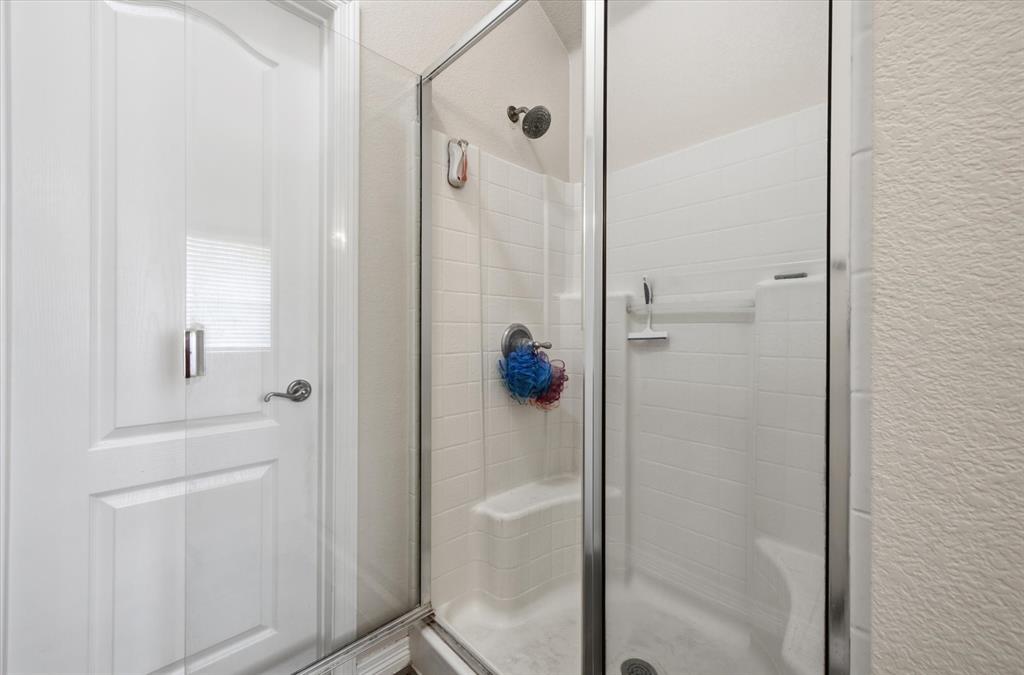 5992 Red Bud Road Fort Worth, TX 76135 - Photo 29 of 40 a bathroom with a shower
