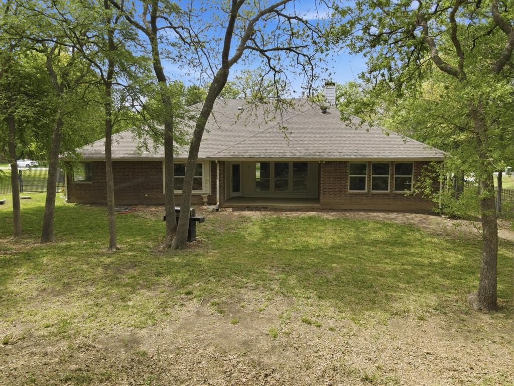 5992 Red Bud Road Fort Worth, TX 76135 - Photo 37 of 40 a view of a house with a yard