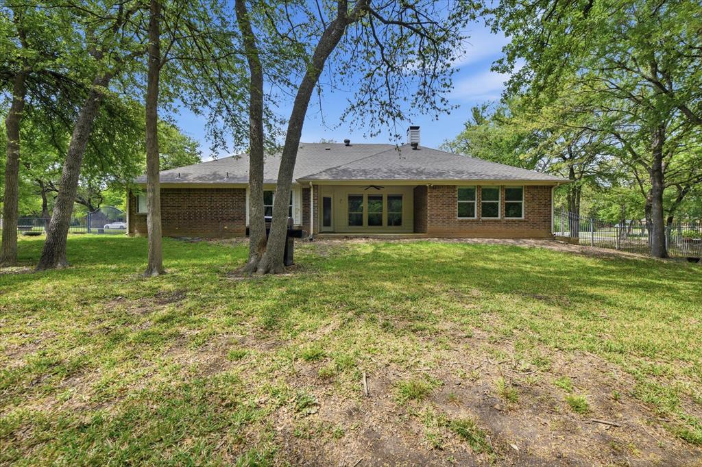 5992 Red Bud Road Fort Worth, TX 76135 - Photo 4 of 40 a view of a house with a yard