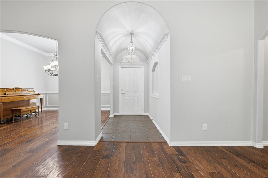5992 Red Bud Road Fort Worth, TX 76135 - Photo 10 of 40 wooden floor in a hall with a window