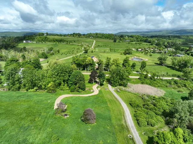 a view of a golf course with a lake