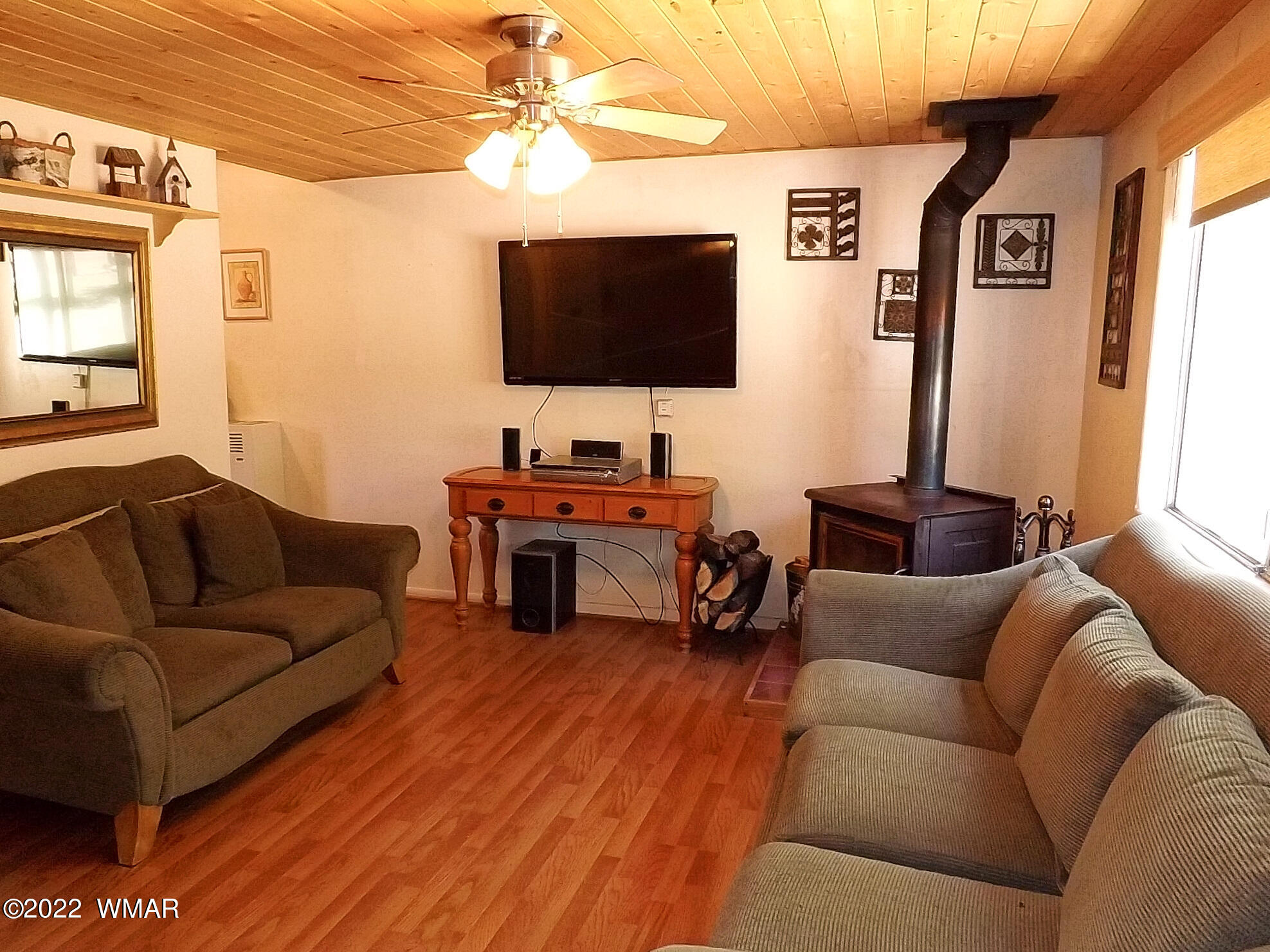2057 Shot Gun Road Overgaard, AZ 85933 - Photo 14 of 24 a living room with furniture and a flat screen tv