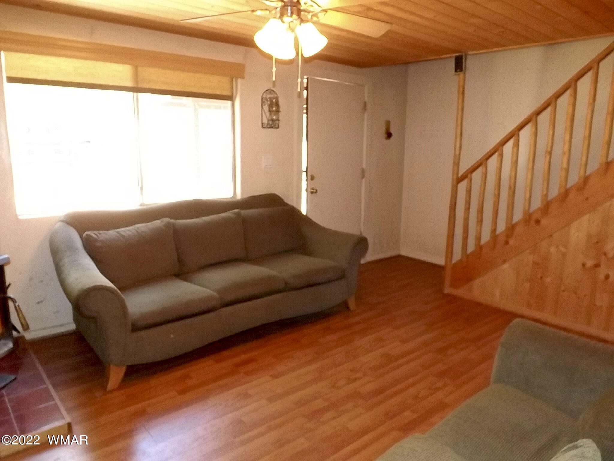 2057 Shot Gun Road Overgaard, AZ 85933 - Photo 16 of 24 a living room with furniture and a window