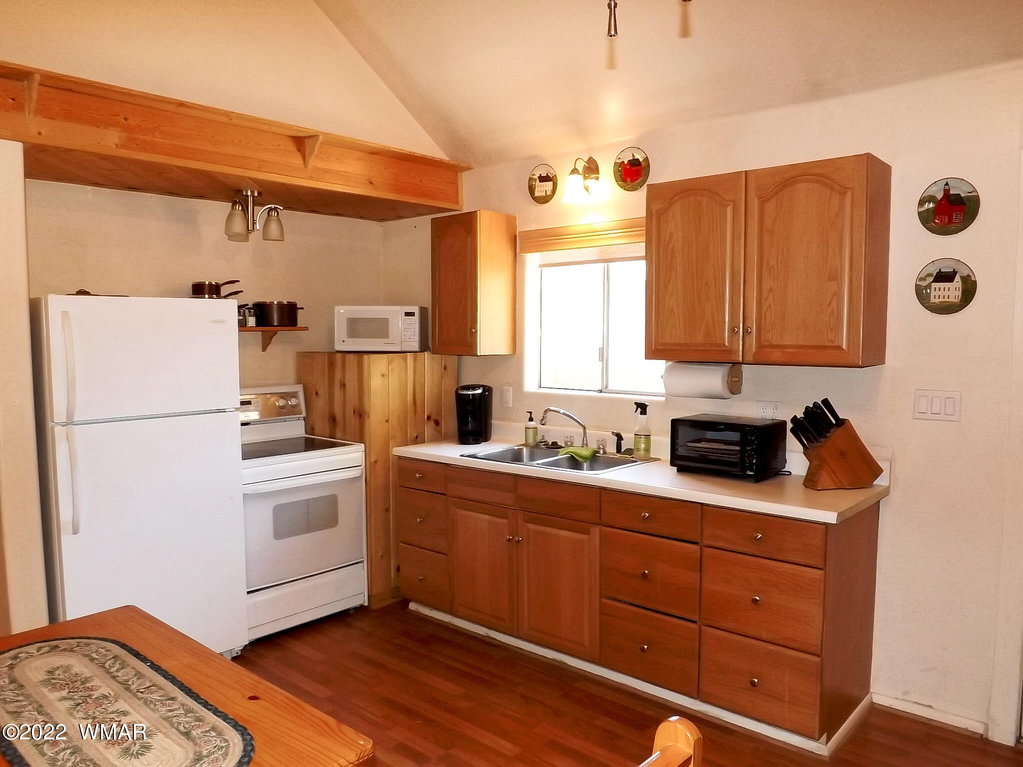 2057 Shot Gun Road Overgaard, AZ 85933 - Photo 18 of 24 a kitchen with stainless steel appliances a refrigerator sink and cabinets