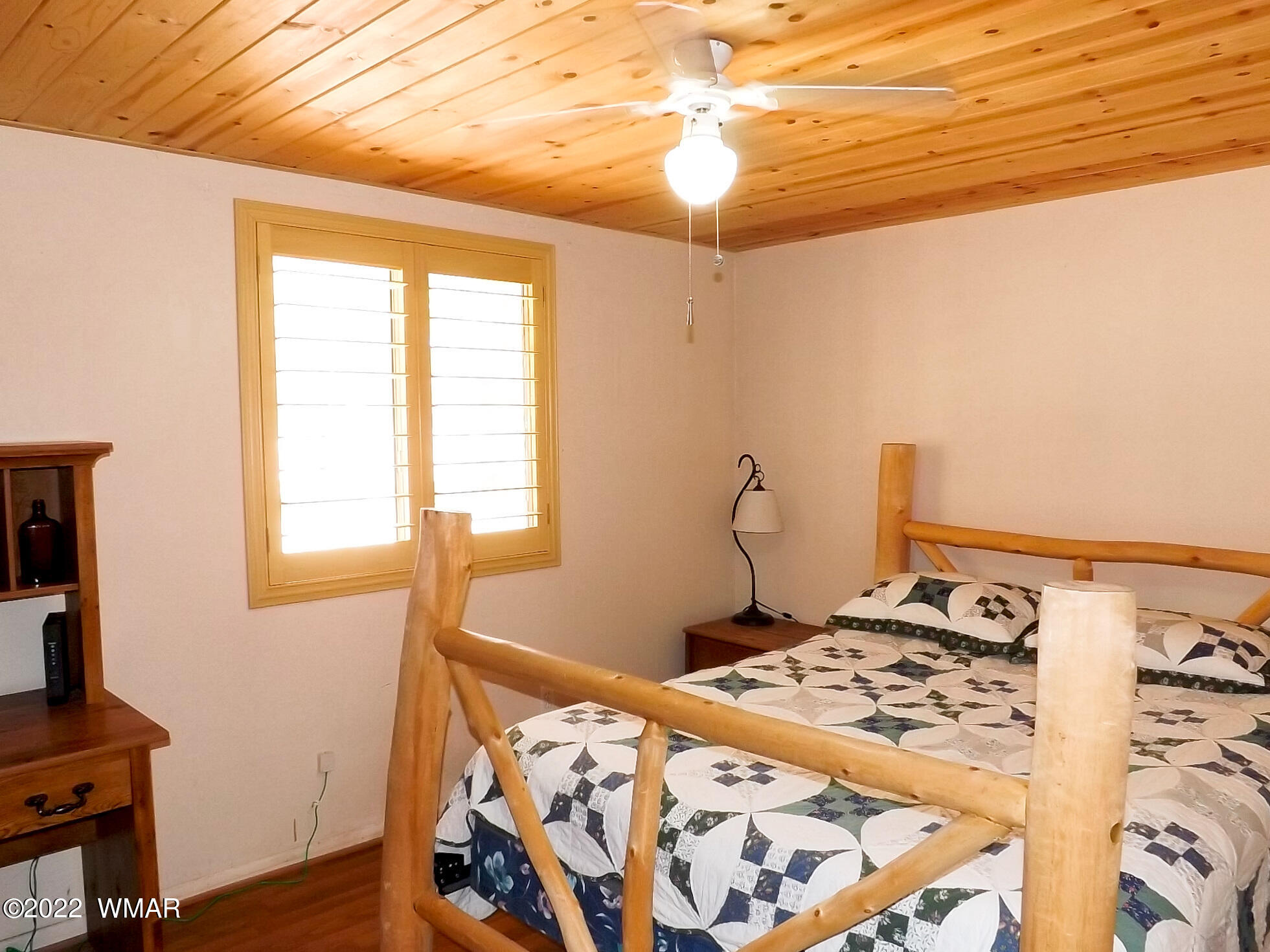 2057 Shot Gun Road Overgaard, AZ 85933 - Photo 21 of 24 a bedroom with a bed and a window