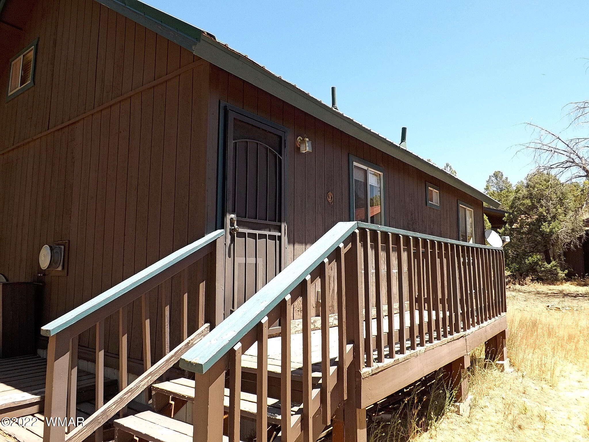 2057 Shot Gun Road Overgaard, AZ 85933 - Photo 5 of 24 a view of staircase with railing and wooden fence
