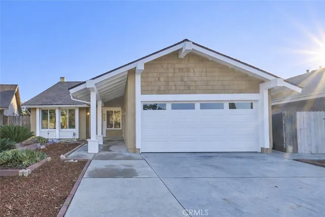 a view of front of house with a yard