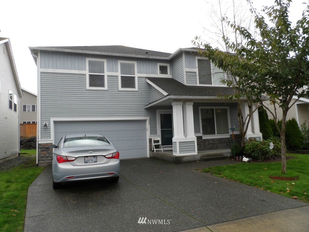 303 Index Place Southeast Renton, WA 98056 - Photo 1 of 14 a car parked in front of a house