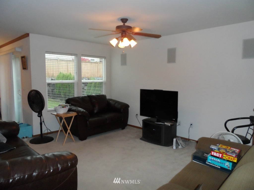303 Index Place Southeast Renton, WA 98056 - Photo 4 of 14 a living room with furniture and a flat screen tv