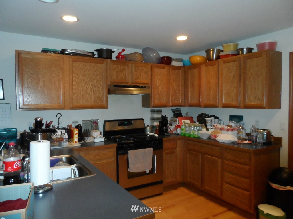 303 Index Place Southeast Renton, WA 98056 - Photo 5 of 14 a kitchen with sink cabinets and appliances