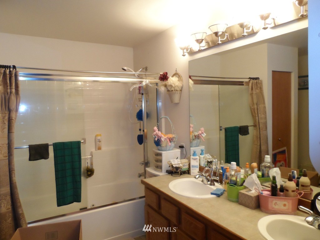 303 Index Place Southeast Renton, WA 98056 - Photo 10 of 14 a bathroom with a sink and a mirror