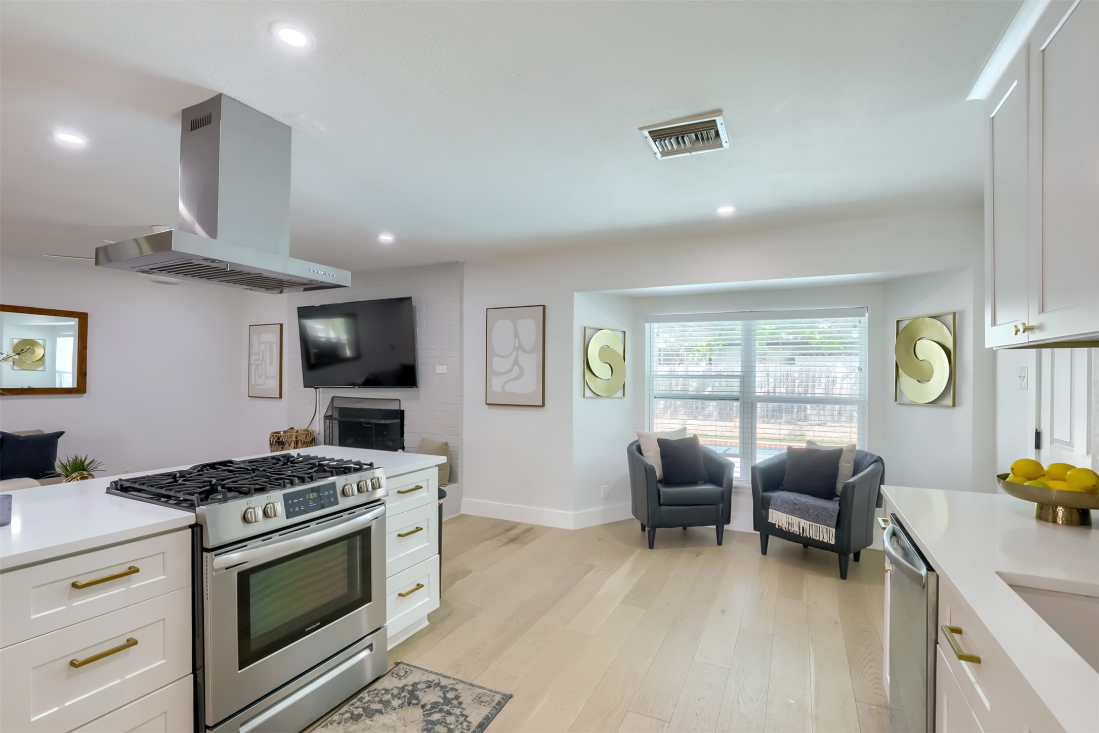 9016 West Pointer Lane Austin, TX 78758 - Photo 28 of 29 a kitchen with stainless steel appliances a stove a table and chairs
