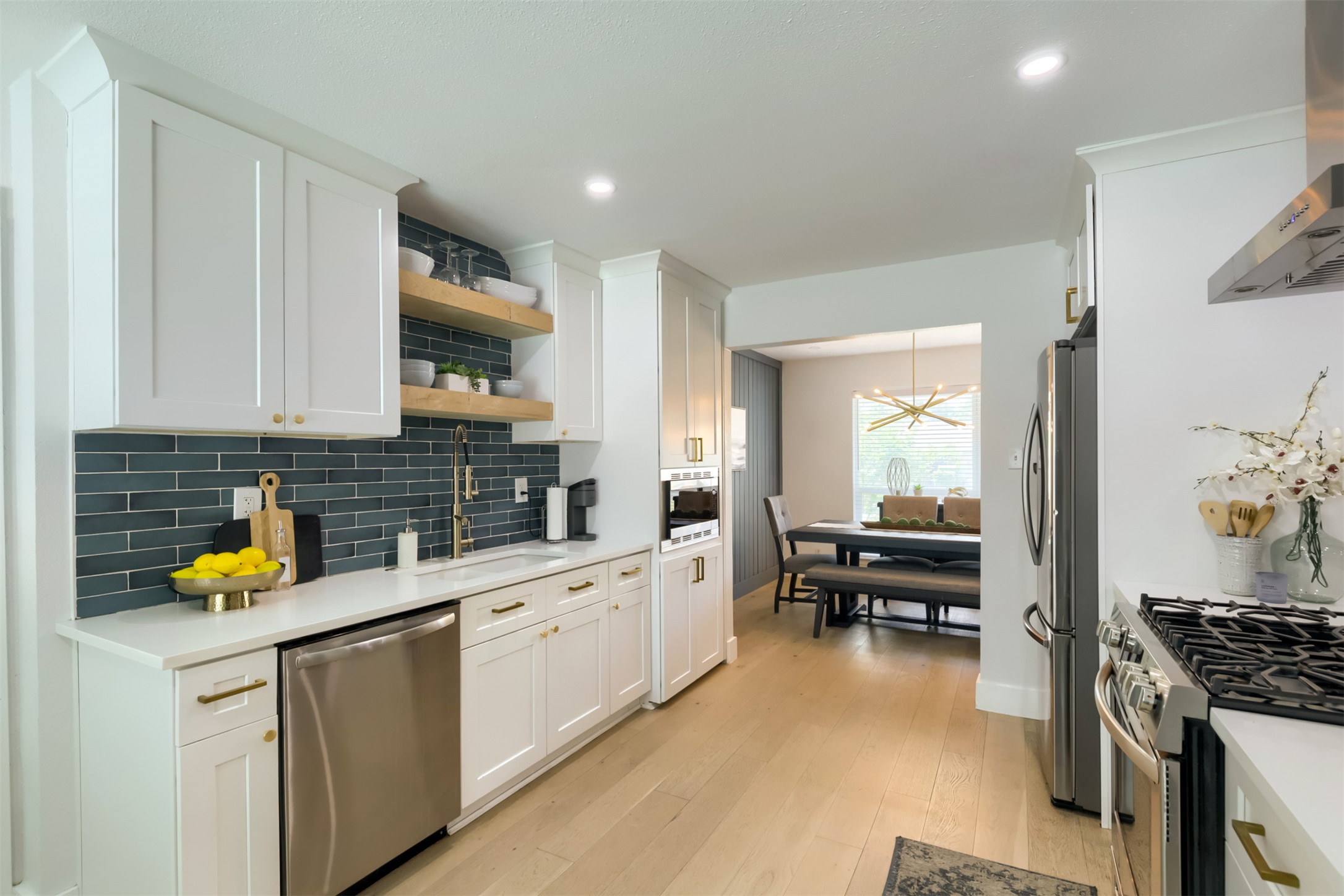 9016 West Pointer Lane Austin, TX 78758 - Photo 12 of 29 a kitchen with a sink stove and cabinets