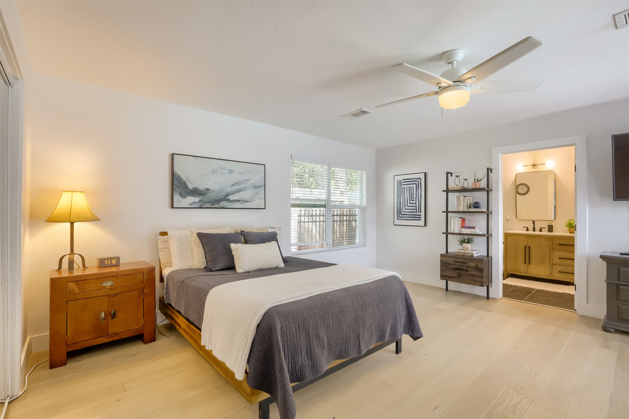 9016 West Pointer Lane Austin, TX 78758 - Photo 13 of 29 a spacious bedroom with a bed and a lamp